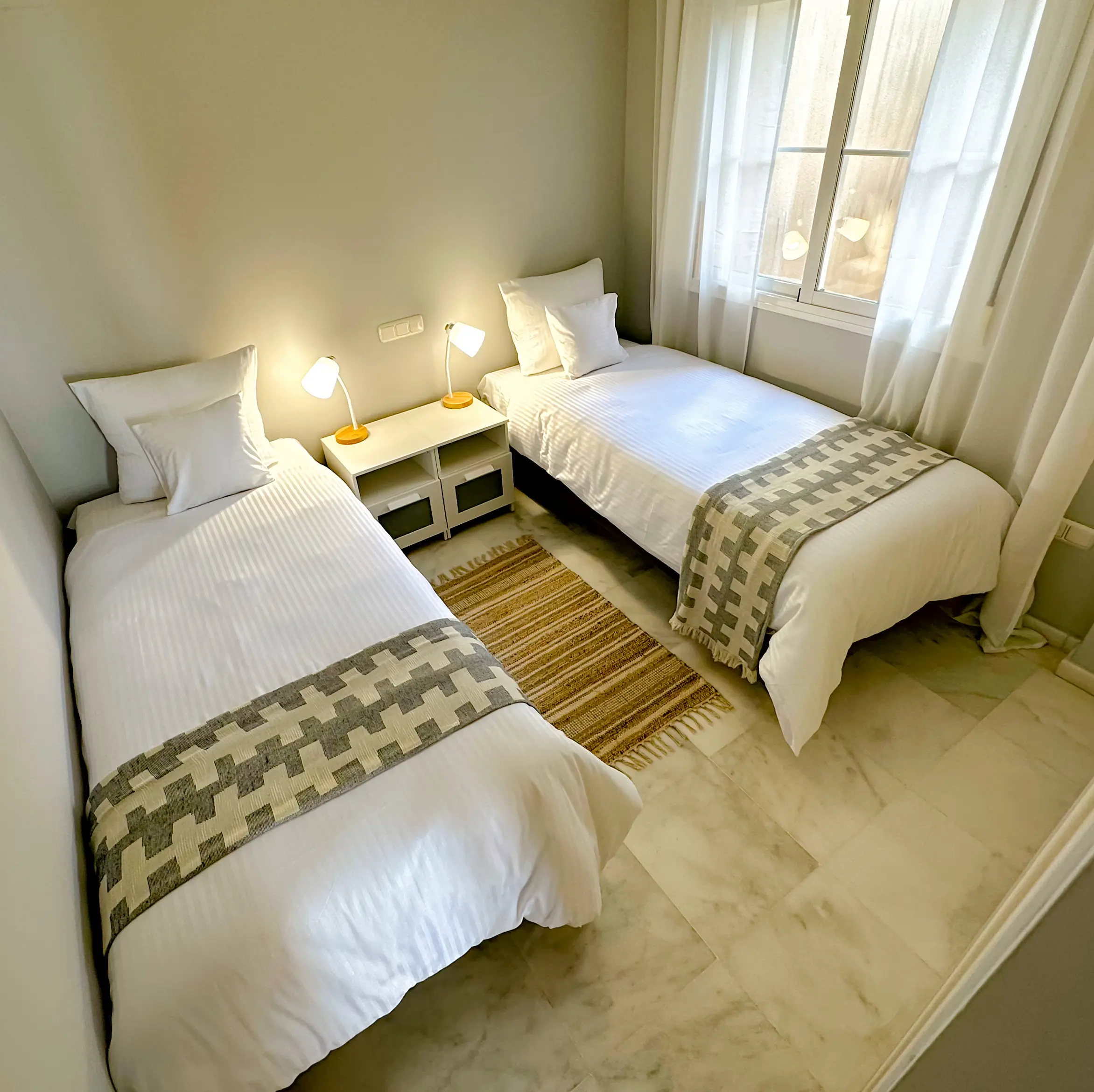 Second bedroom - Here you will find two separate beds (90x200cm), which can be joined together. Each has its own table and individual night lights.