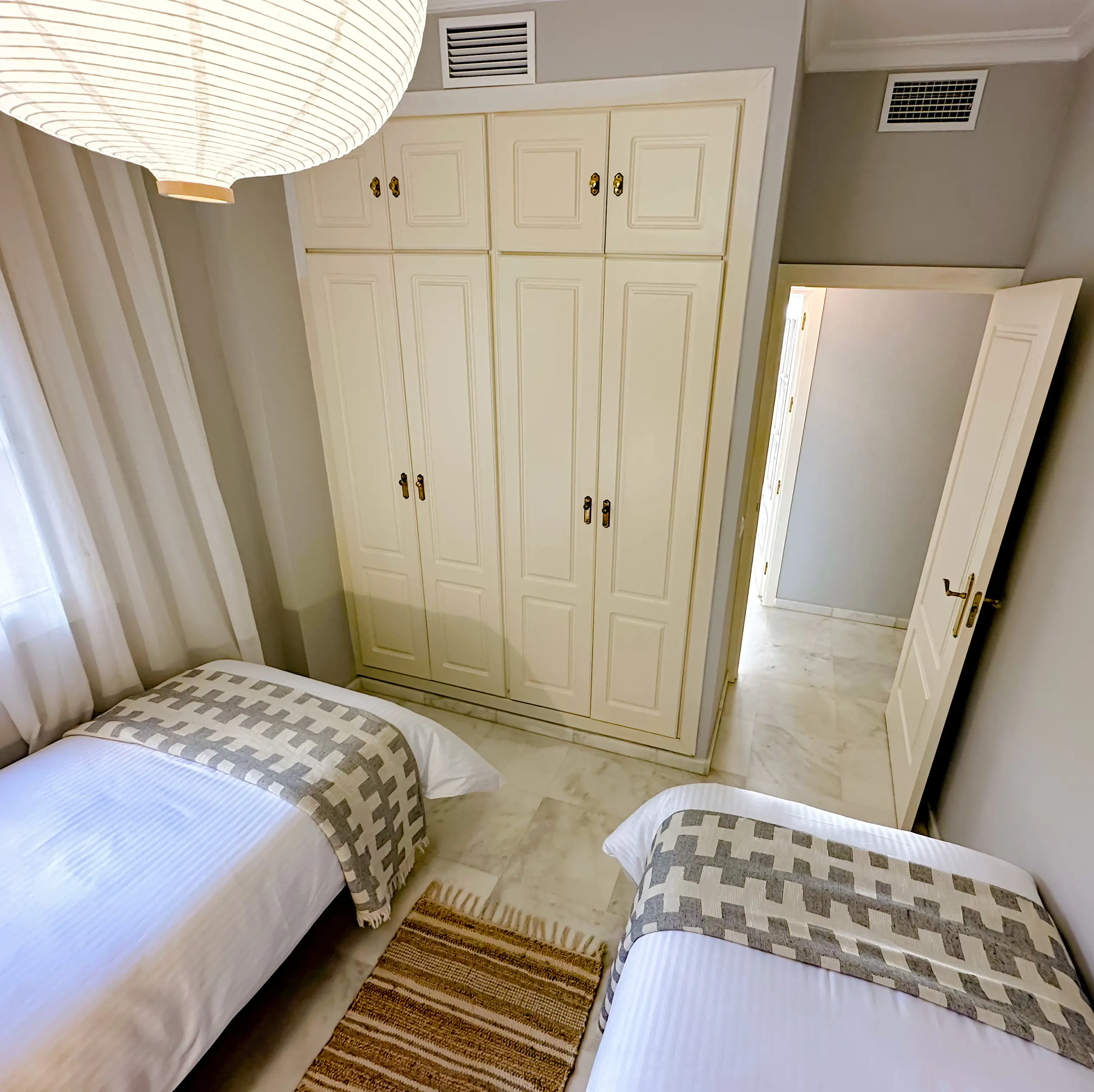 Second bedroom - This large wardrobe, aside from clothes hangers, contains an iron, an ironing board and a drying rack for your laundry.